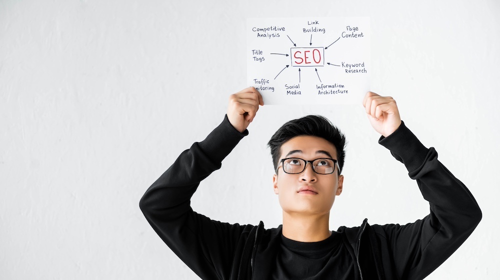 Practice Owners: Optimize Your Practice Site for Local Searches 2 asian seo manager holding and looking at paper wit 2023 11 27 05 13 20 utc